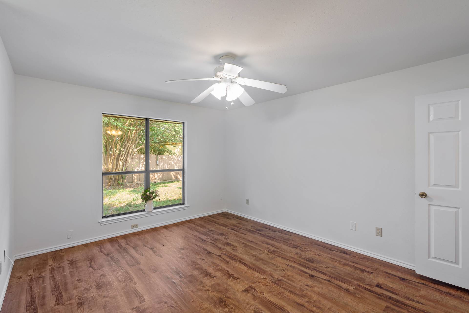 1802 Dixie Lane Round Rock, TX 78664 - Photo 21 of 30 wooden floor in an empty room with a window
