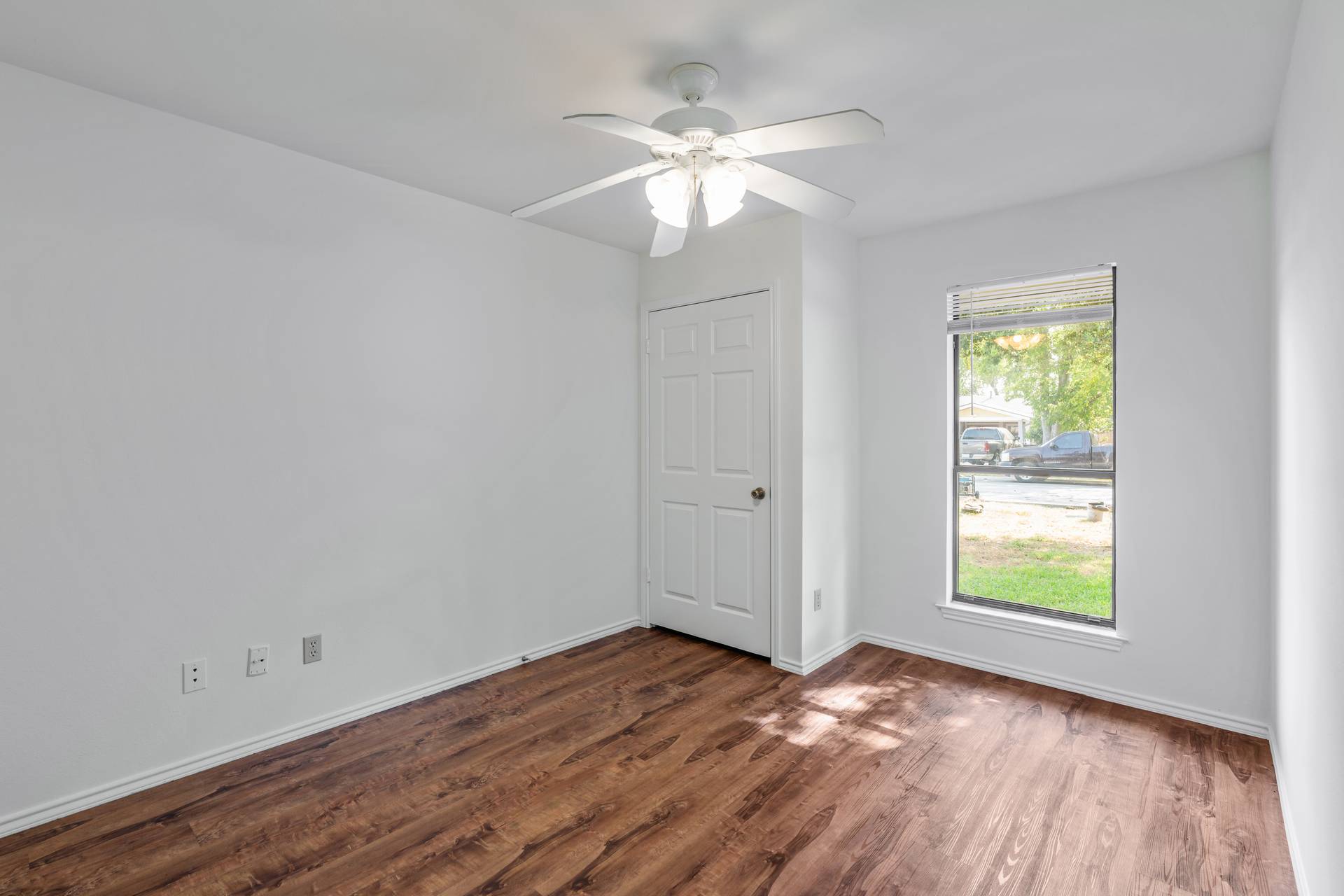 1802 Dixie Lane Round Rock, TX 78664 - Photo 7 of 30 a view of an empty room with wooden floor and a window