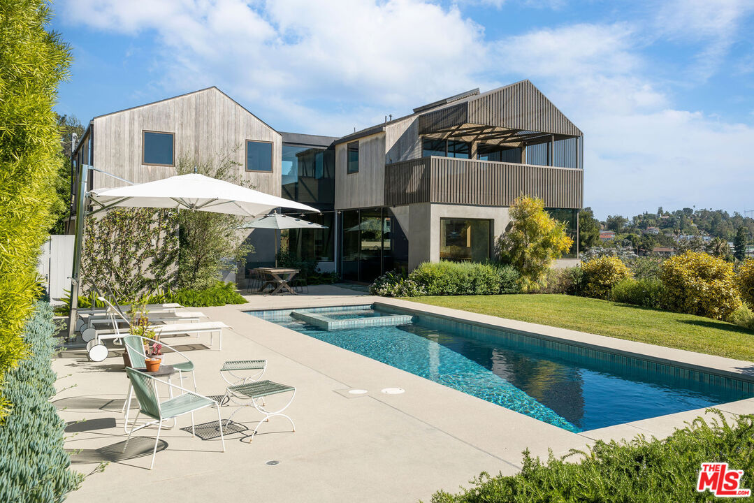 a front view of a house with swimming pool
