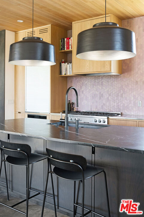 2634 Silver Ridge Avenue Los Angeles, CA 90039 - Photo 11 of 44 a kitchen with a sink cabinets and window