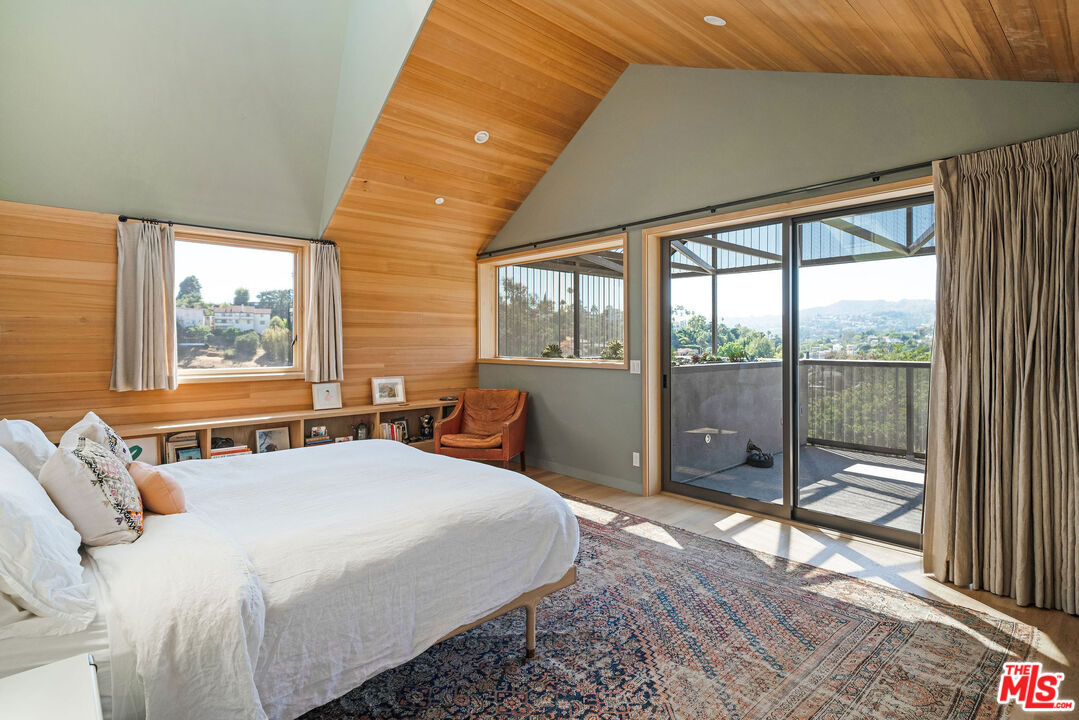2634 Silver Ridge Avenue Los Angeles, CA 90039 - Photo 20 of 44 a bedroom with a bed and a large window