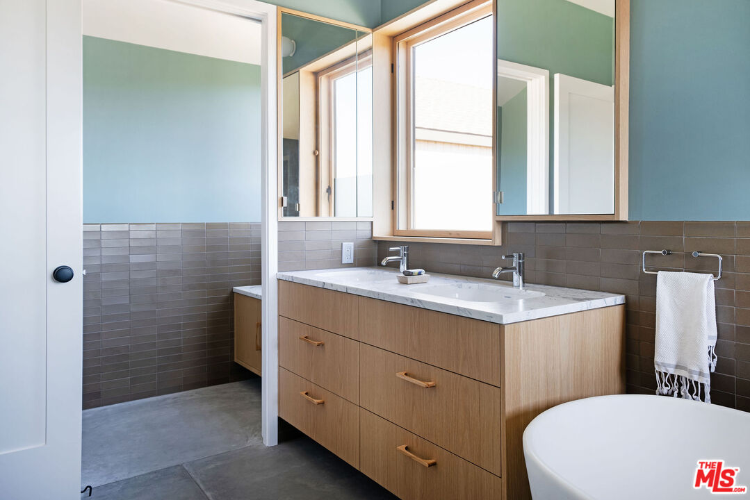 2634 Silver Ridge Avenue Los Angeles, CA 90039 - Photo 28 of 44 a bathroom with a double vanity sink toilet mirror and window