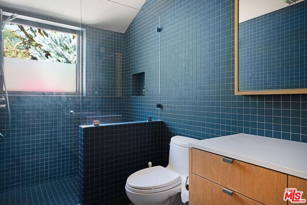 2634 Silver Ridge Avenue Los Angeles, CA 90039 - Photo 38 of 44 a bathroom with a toilet a sink and mirror
