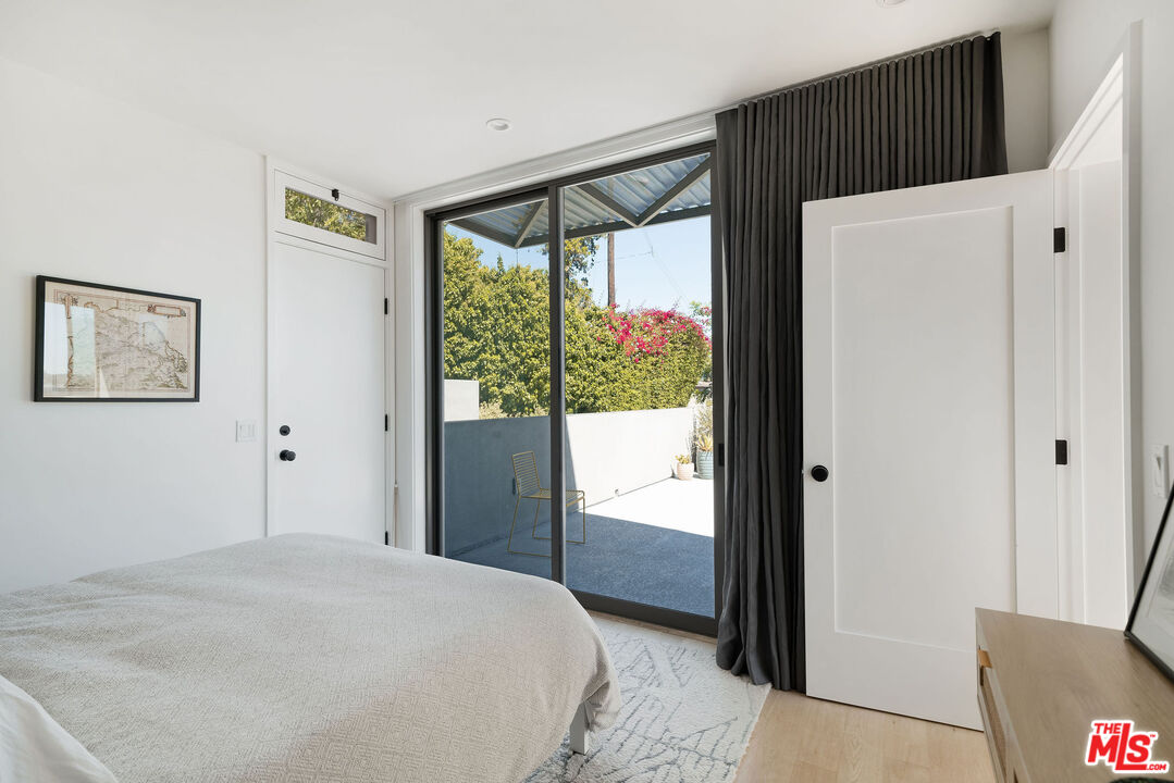 2634 Silver Ridge Avenue Los Angeles, CA 90039 - Photo 39 of 44 a bedroom with a bed and a window