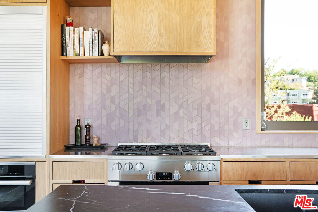 2634 Silver Ridge Avenue Los Angeles, CA 90039 - Photo 10 of 44 a kitchen with stainless steel appliances granite countertop a stove and a sink