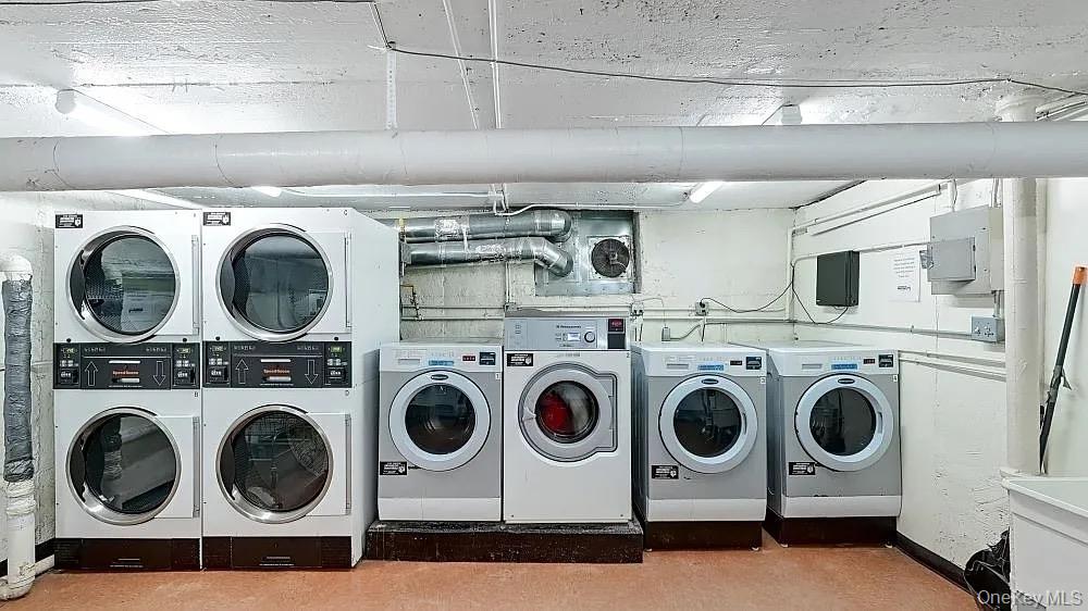 8384 116th Street, Unit 5G Queens, NY 11418 - Photo 16 of 17 a utility room with dryer washer and a view of kitchen