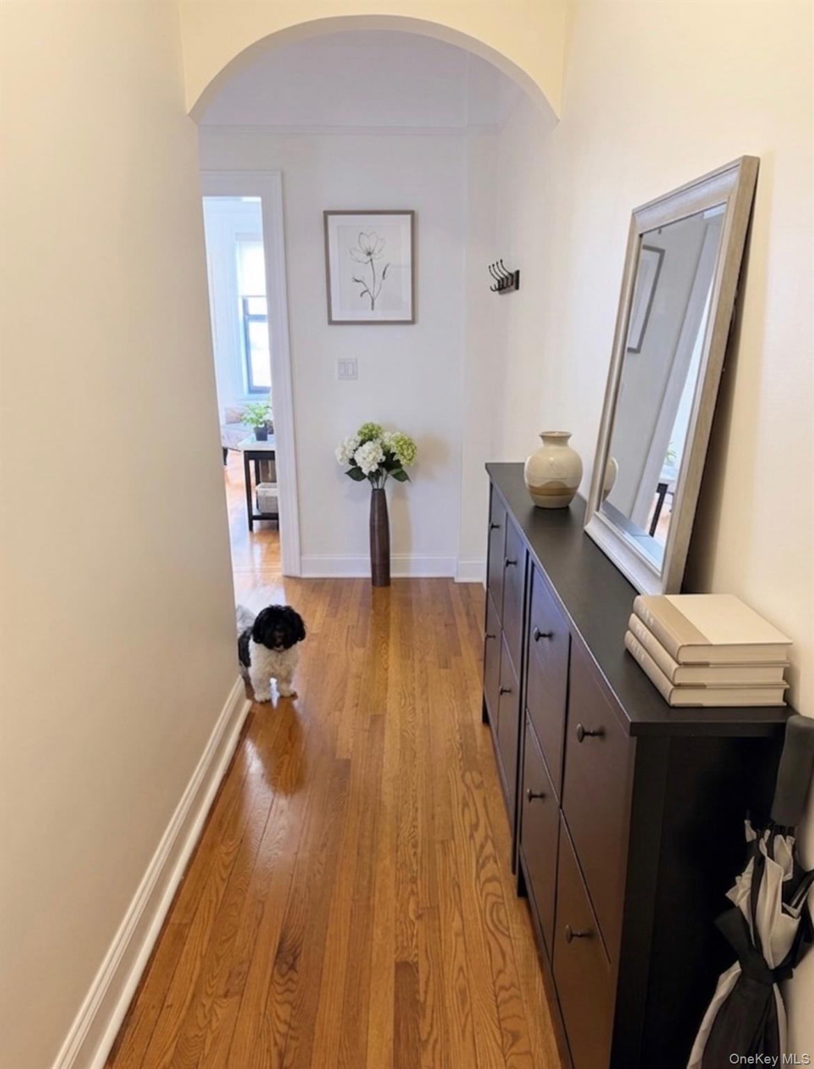 8384 116th Street, Unit 5G Queens, NY 11418 - Photo 3 of 17 a view of a room with wooden floor and staircase