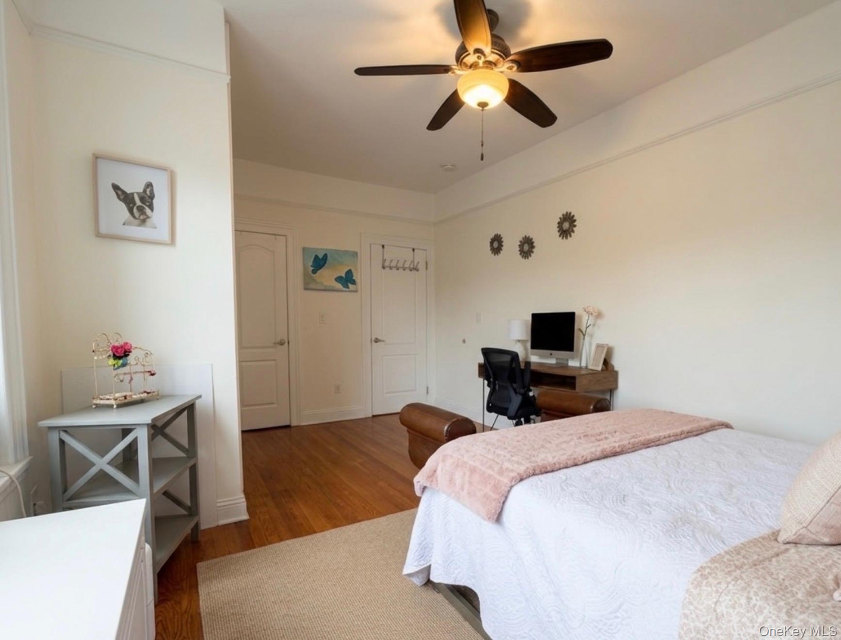 8384 116th Street, Unit 5G Queens, NY 11418 - Photo 7 of 17 a bedroom with a bed and a flat screen tv