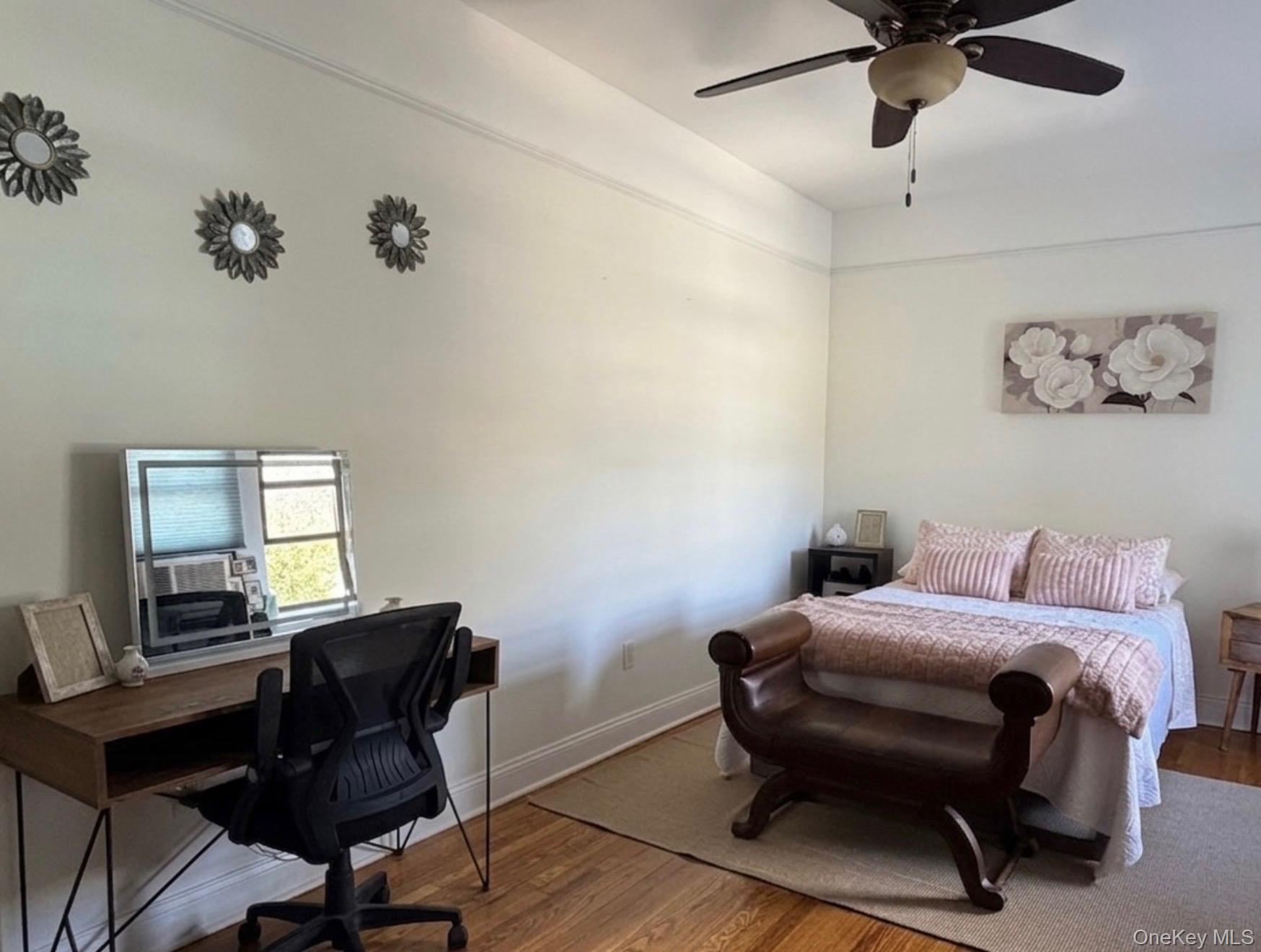8384 116th Street, Unit 5G Queens, NY 11418 - Photo 9 of 17 a bedroom with a bed and a desk
