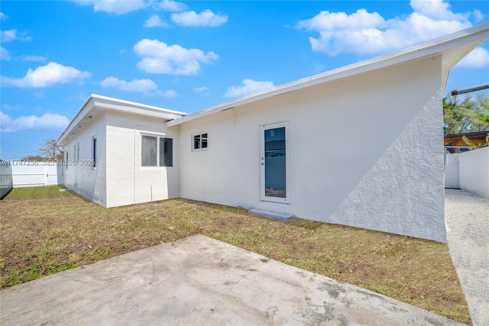 10272 Southwest 178th Street, Unit 1 Miami, FL 33157 - Photo 2 of 8 a view of backyard of the house