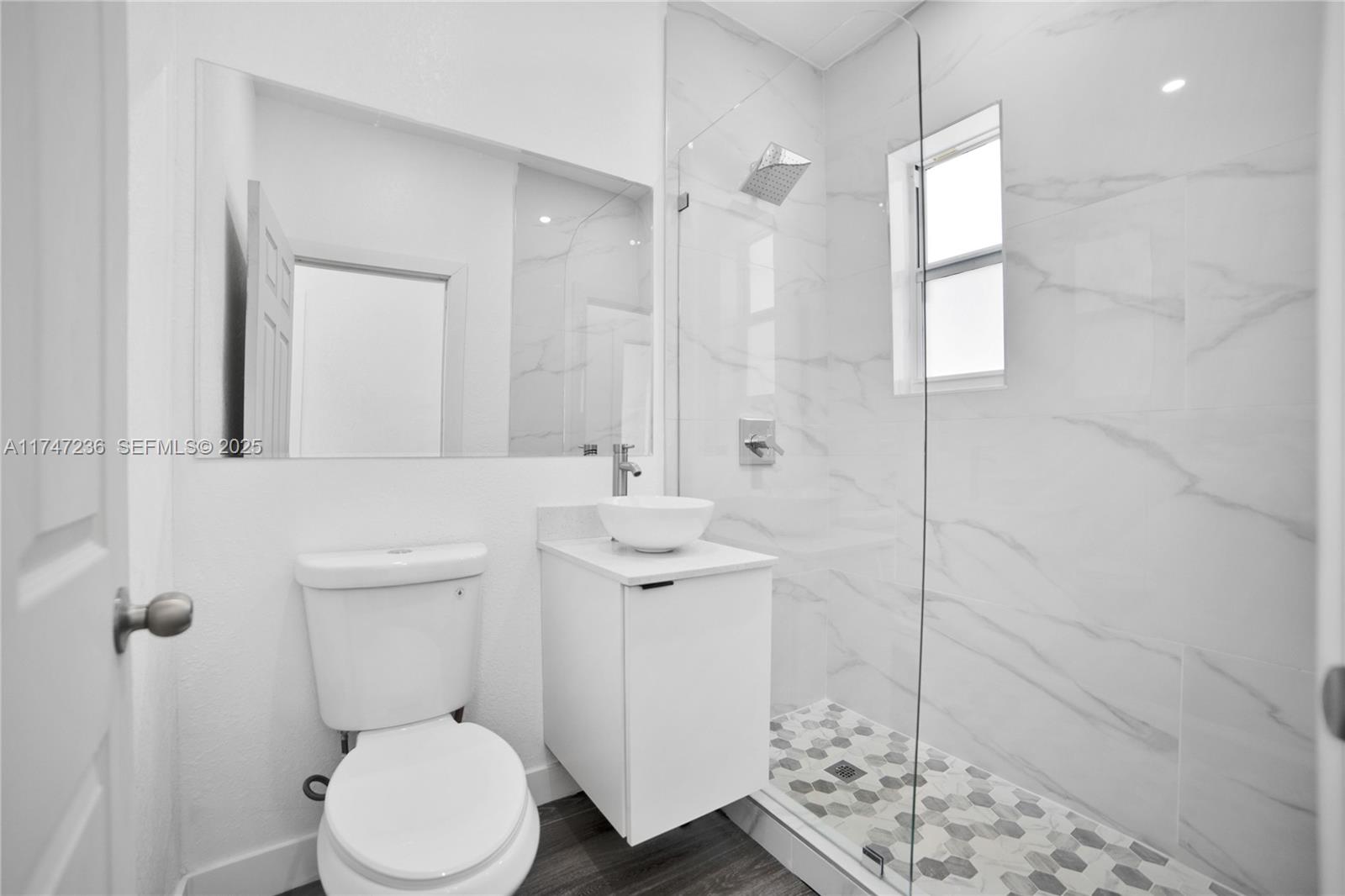10272 Southwest 178th Street, Unit 1 Miami, FL 33157 - Photo 8 of 8 a bathroom with a sink toilet and shower