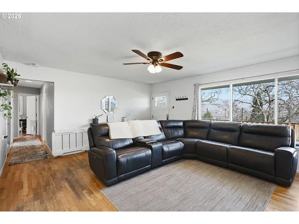 a living room with furniture and a large window