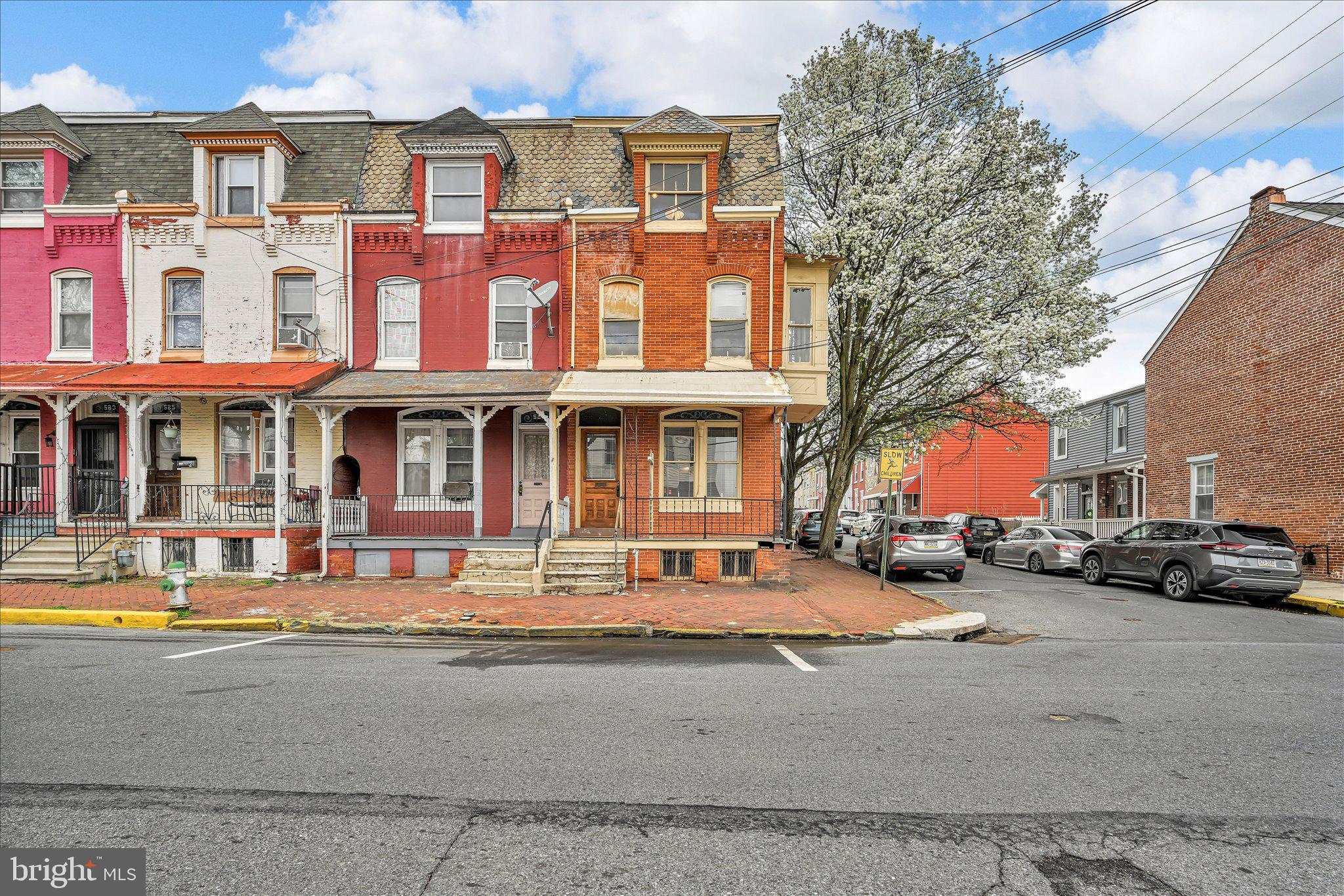 529 Windsor Street Reading, PA 19601 - Photo 1 of 36 a red building on the side of a street