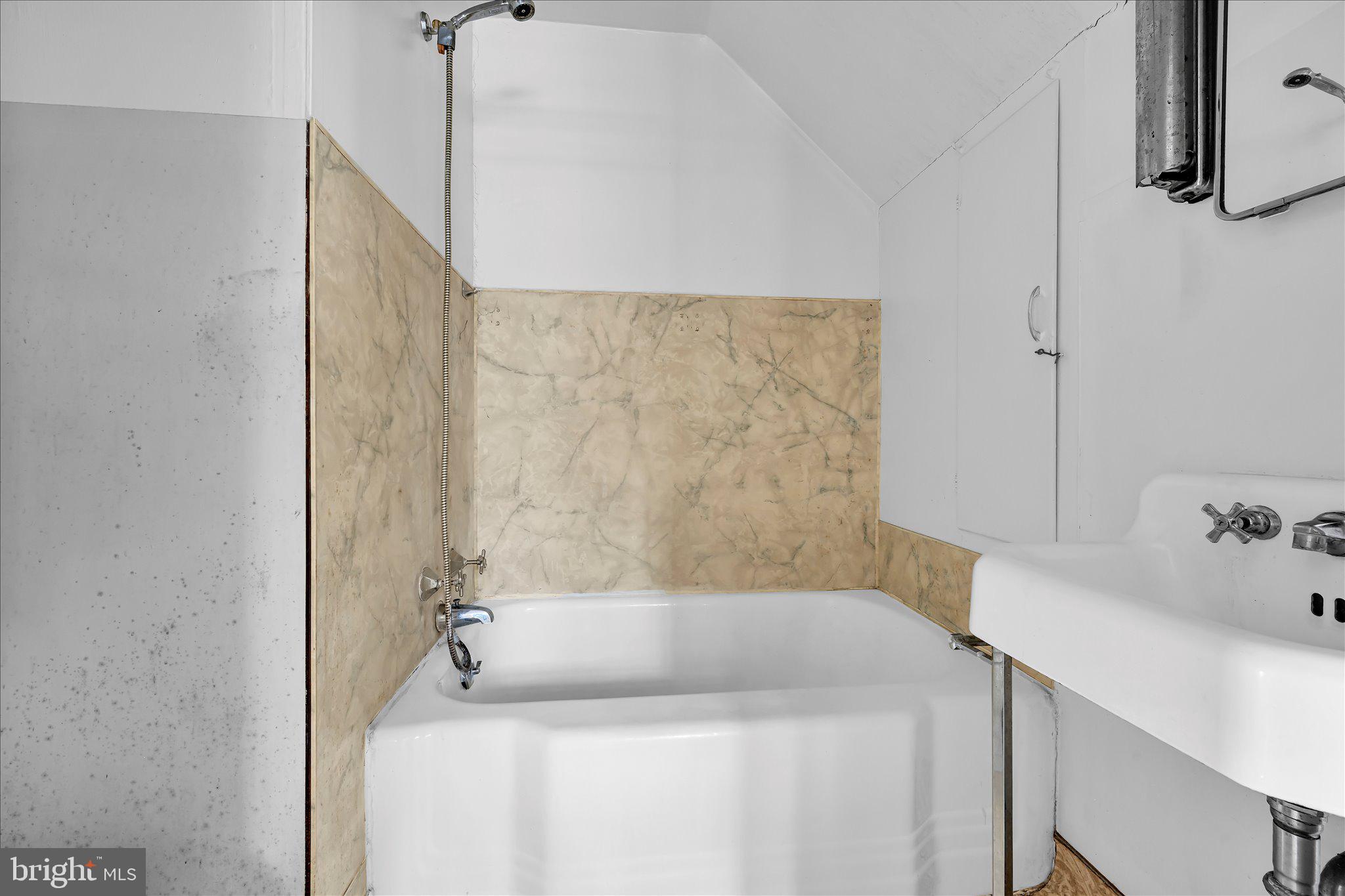 529 Windsor Street Reading, PA 19601 - Photo 11 of 36 a bathroom with a bathtub and shower