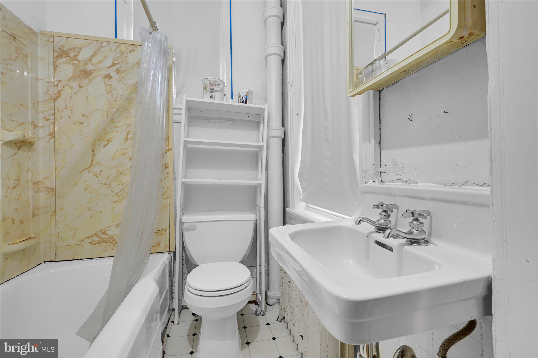 529 Windsor Street Reading, PA 19601 - Photo 17 of 36 a bathroom with a sink toilet and shower