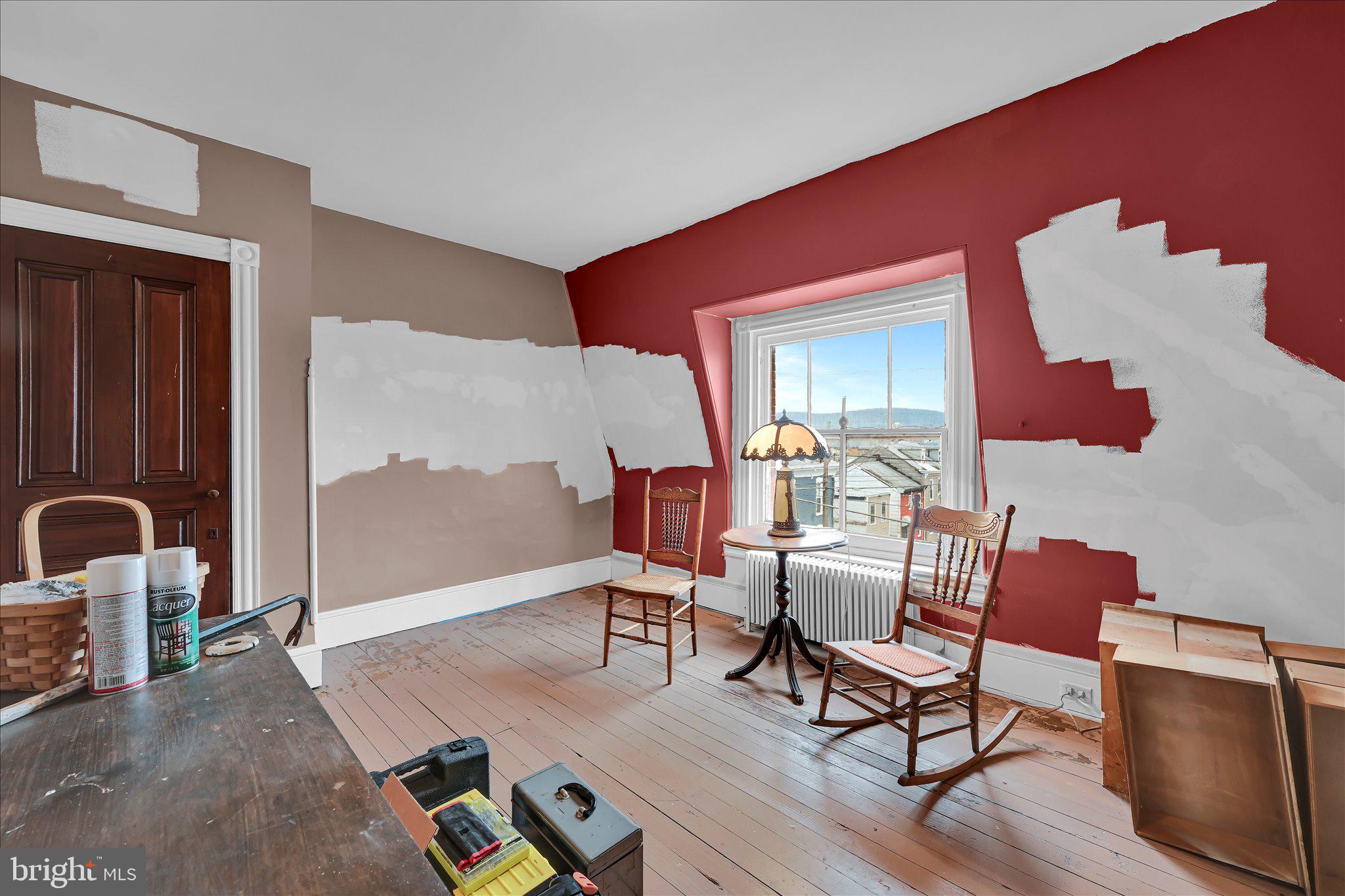 529 Windsor Street Reading, PA 19601 - Photo 19 of 36 a living room with furniture and a painting on the wall