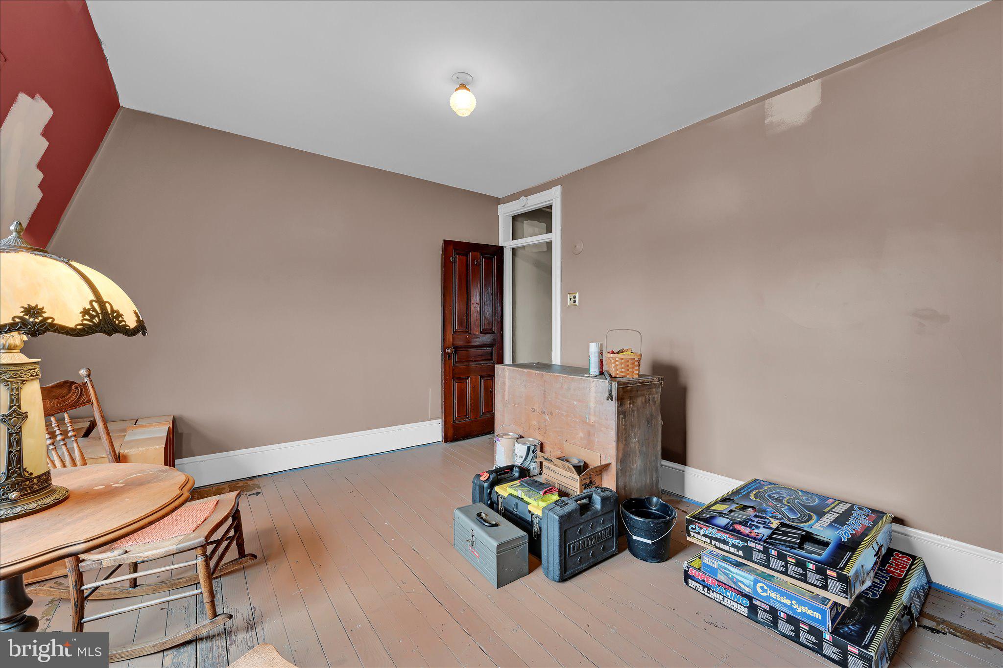529 Windsor Street Reading, PA 19601 - Photo 20 of 36 a living room with furniture and a wooden floor