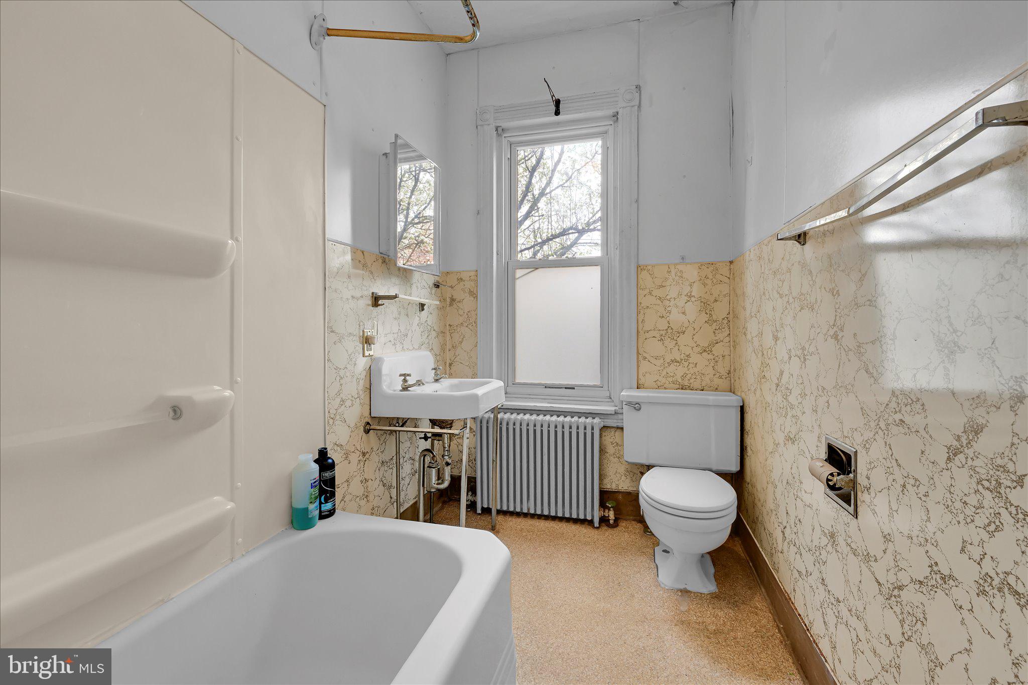 529 Windsor Street Reading, PA 19601 - Photo 28 of 36 a bathroom with a sink toilet bathtub and shower