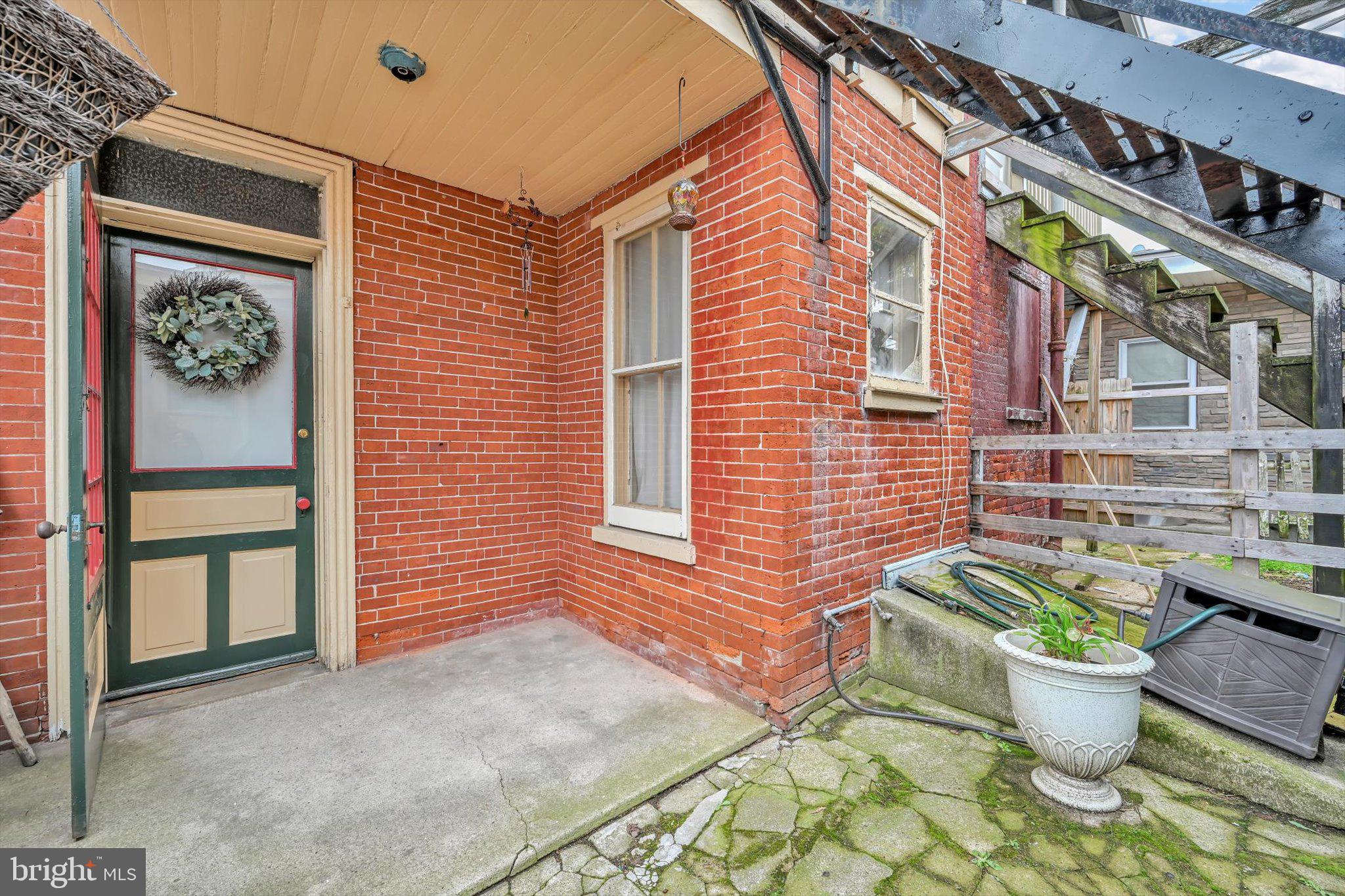 529 Windsor Street Reading, PA 19601 - Photo 31 of 36 a front view of a house with chairs