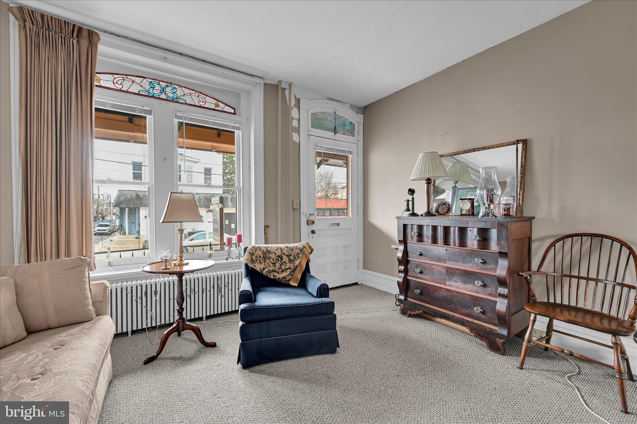529 Windsor Street Reading, PA 19601 - Photo 7 of 36 a living room with furniture and a window