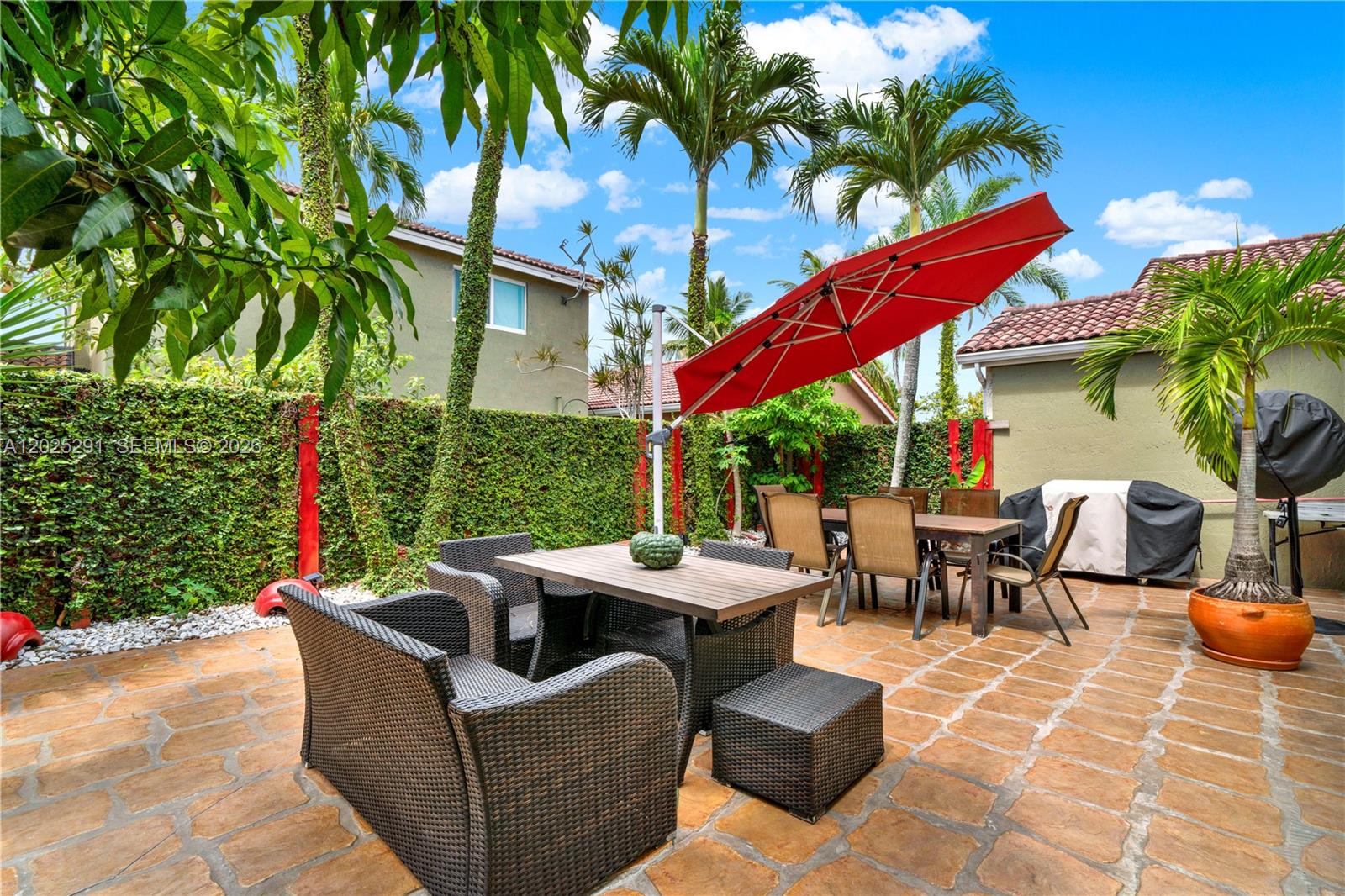 10006 Southwest 162nd Path Miami, FL 33196 - Photo 31 of 40 a outdoor space with patio furniture