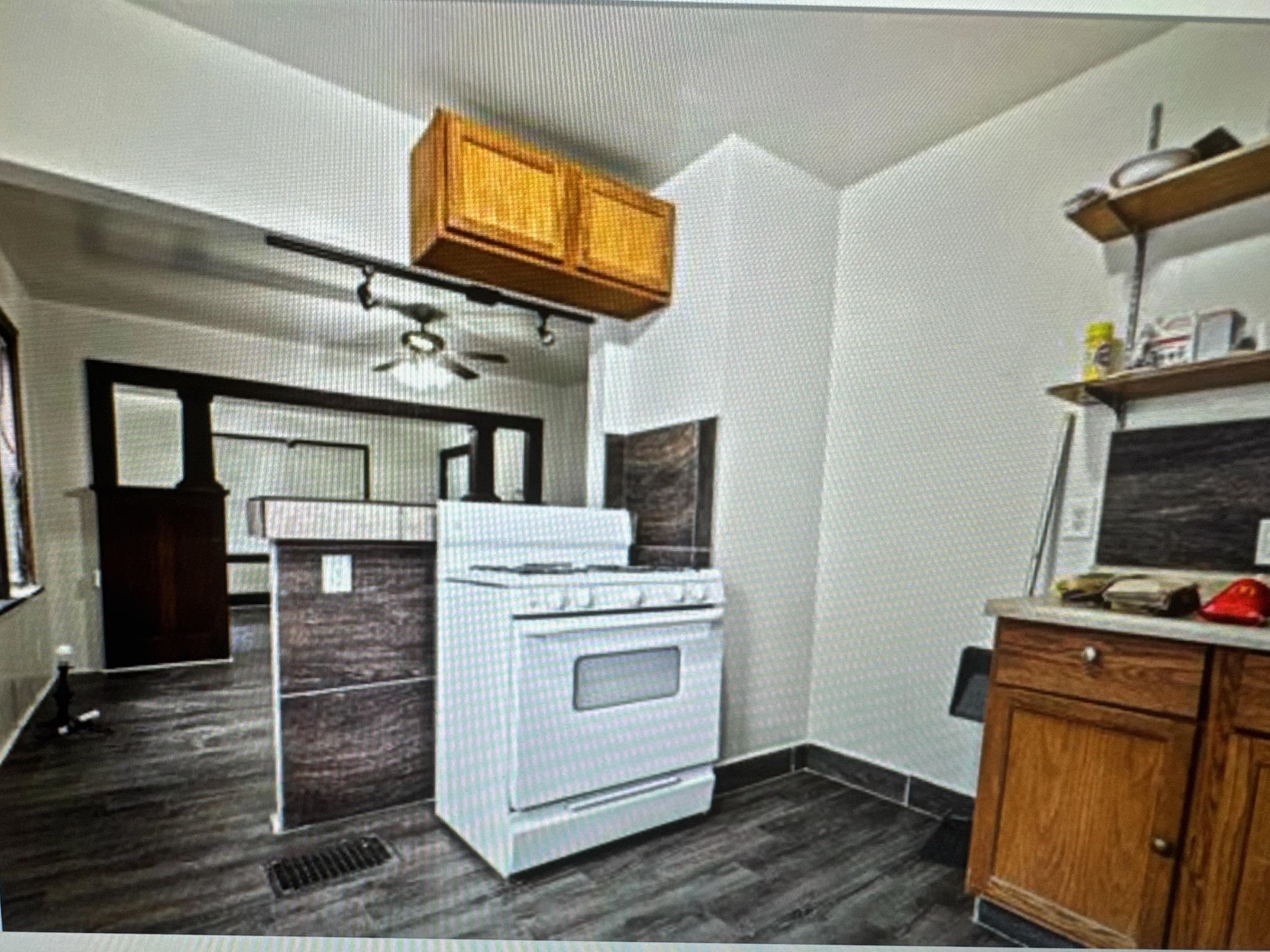 314 North Longwood Street Rockford, IL 61107 - Photo 2 of 11 a view of kitchen with cabinets and wooden floor