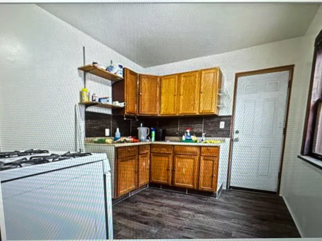 a kitchen with stainless steel appliances granite countertop a stove and a refrigerator