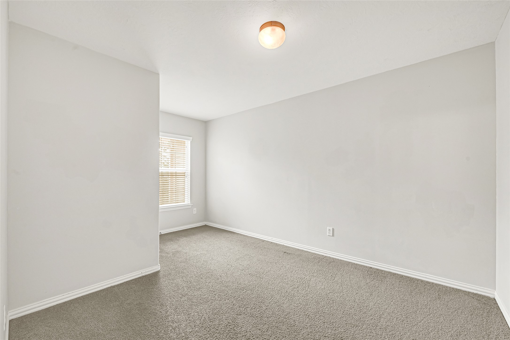 5010 Dartmoor Ridge Trail Houston, TX 77066 - Photo 20 of 28 an empty room with a empty space and window