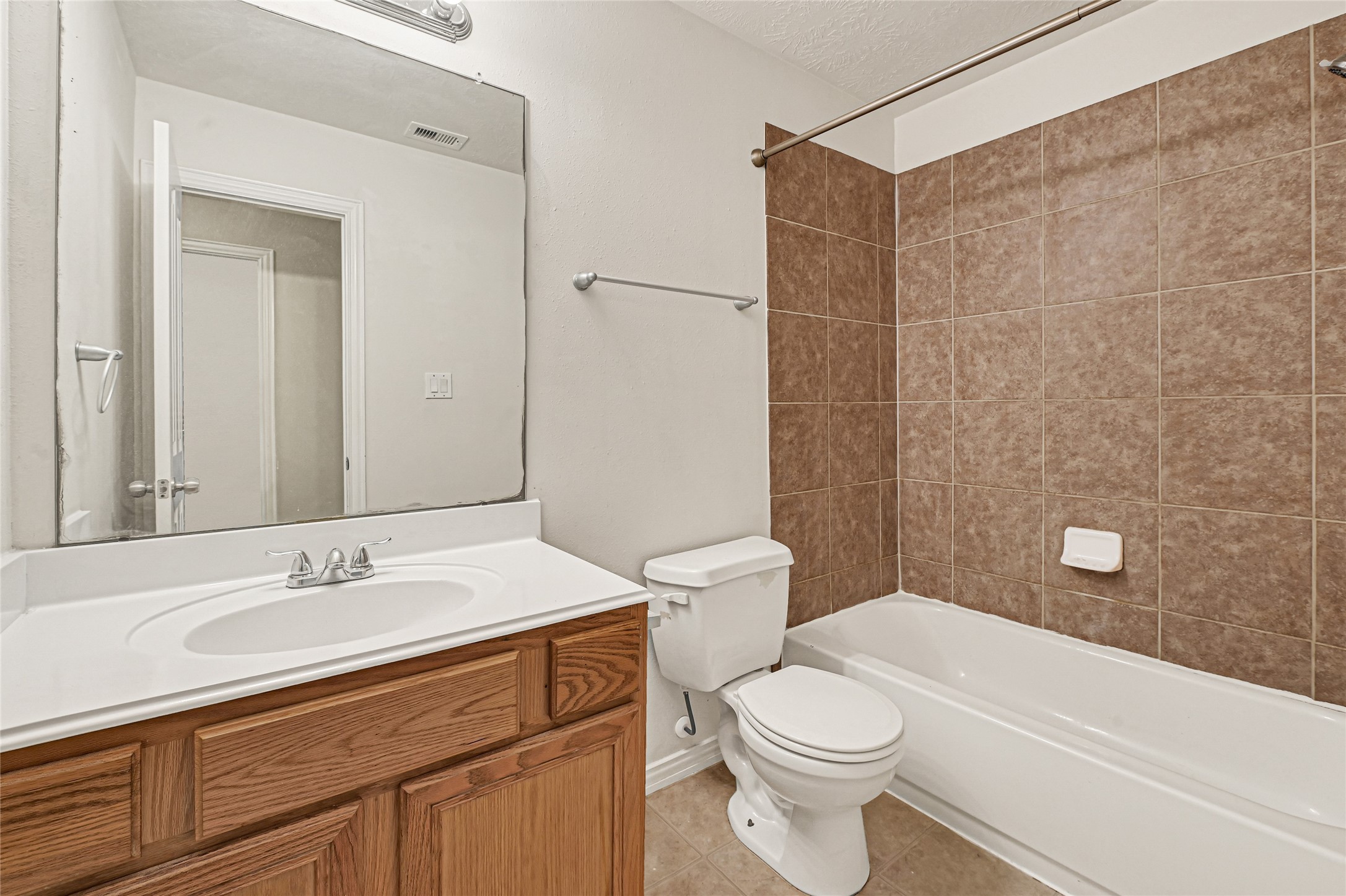 5010 Dartmoor Ridge Trail Houston, TX 77066 - Photo 23 of 28 a bathroom with a sink a toilet and shower