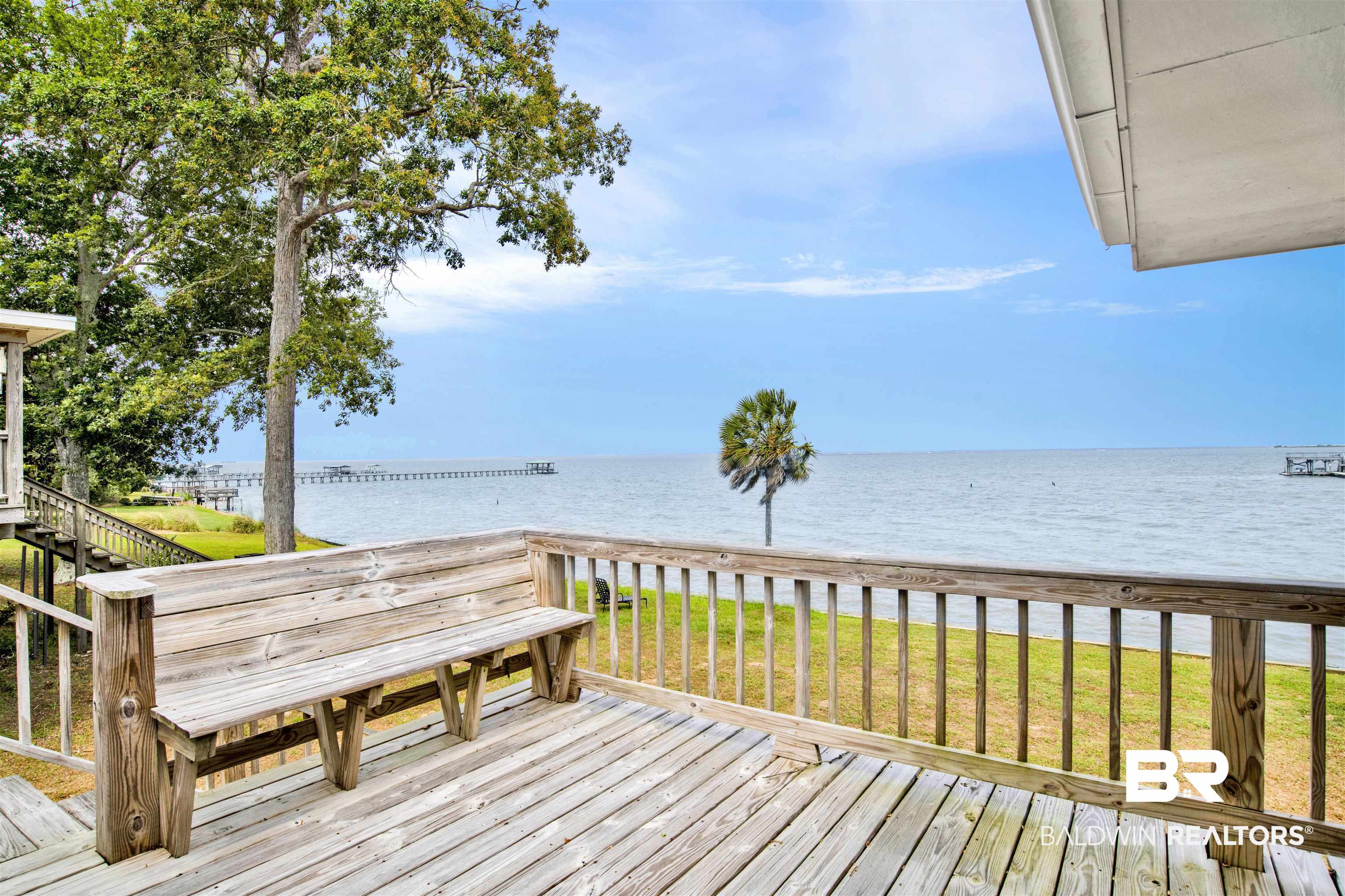 7411 Bay Road Mobile, AL 36605 - Photo 20 of 34 Wooden deck featuring a lawn and a water view