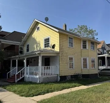 front view of a house with a yard