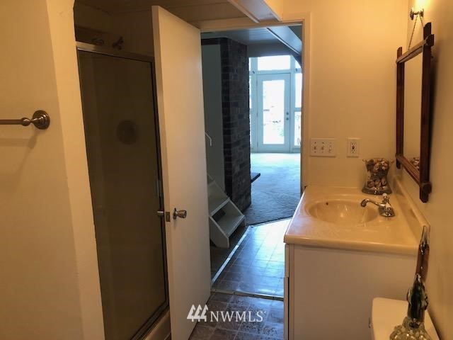 341 East Canyon View Road Belfair, WA 98528 - Photo 8 of 19 a bathroom with a sink toilet and shower