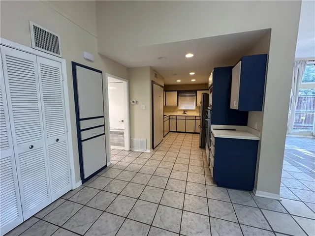 a kitchen with sink cabinets and stove