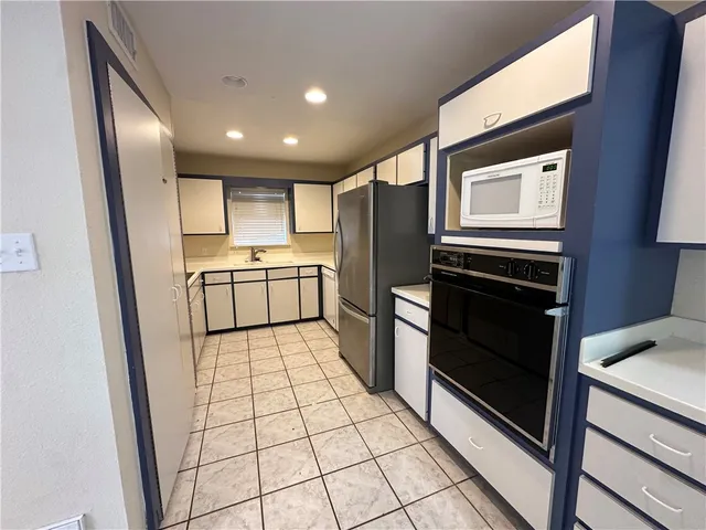 a view of workspace with wooden floor and window