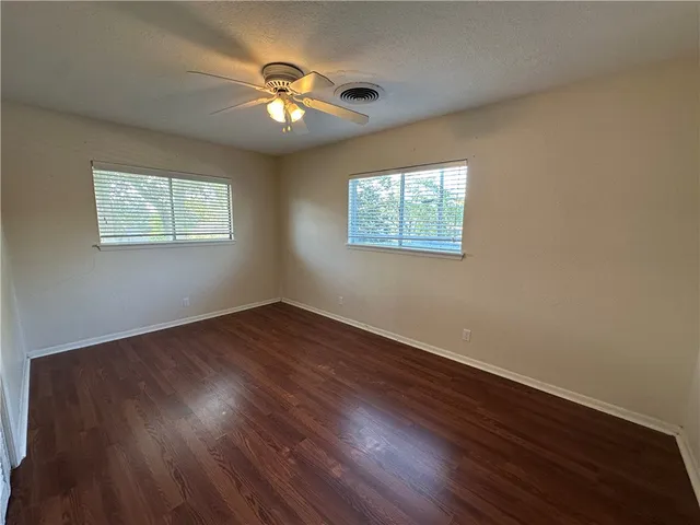 a bathroom with a double vanity sink and mirror