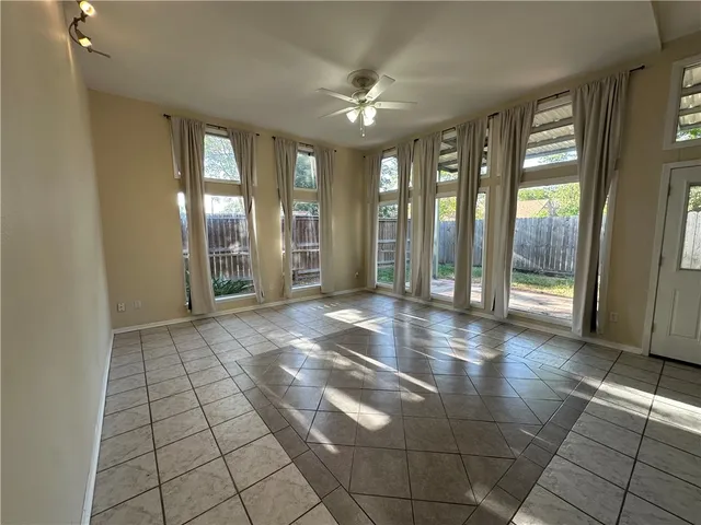 a kitchen with stainless steel appliances a refrigerator and a stove top oven