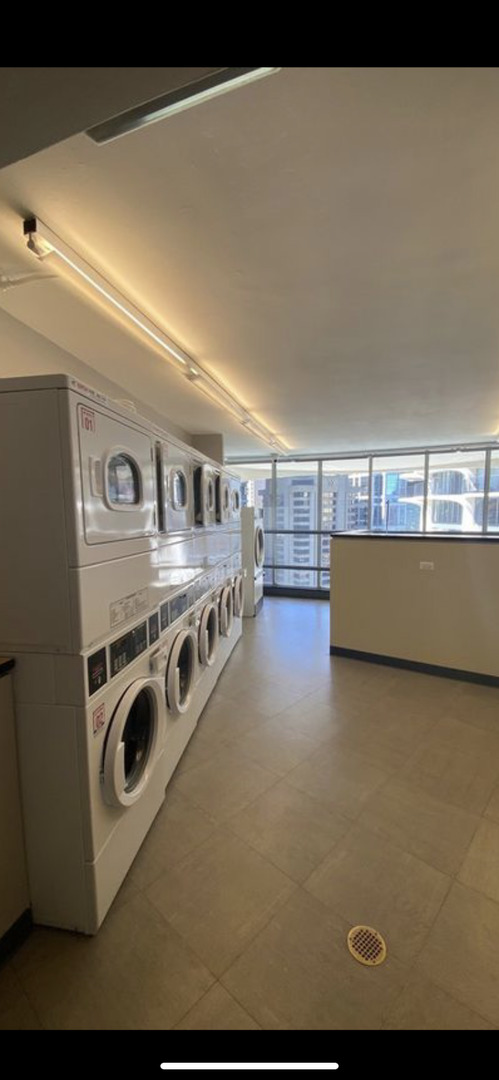 300 North State Street, Unit 2103 Chicago, IL 60654 - Photo 21 of 26 a view of a livingroom with furniture