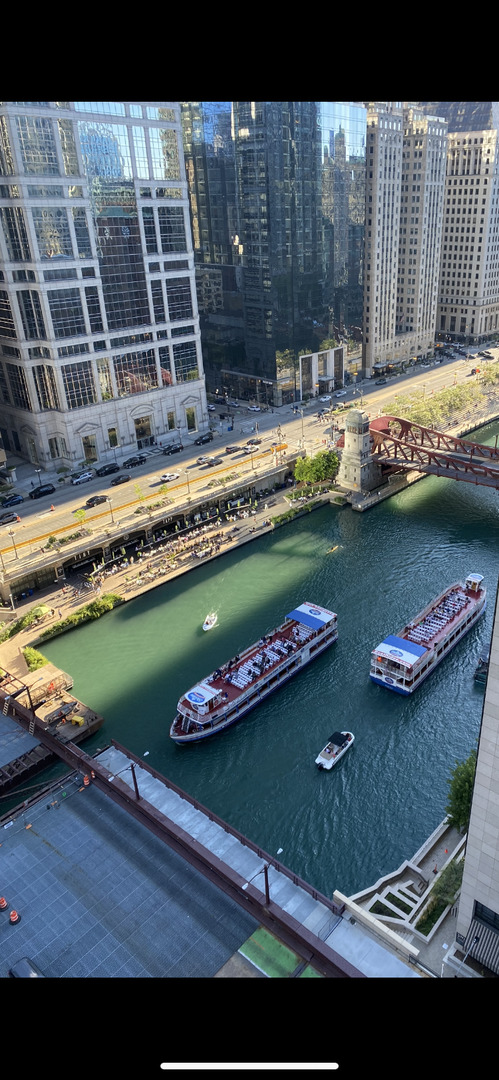 300 North State Street, Unit 2103 Chicago, IL 60654 - Photo 4 of 26 a view of swimming pool with outdoor seating
