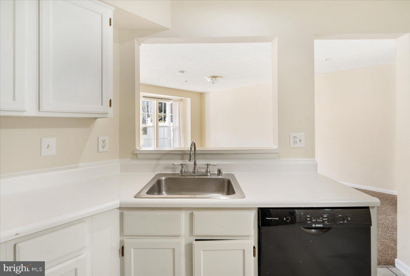 4260 Maple Path Circle, Unit 15 Nottingham, MD 21236 - Photo 16 of 35 a kitchen with a sink and cabinets