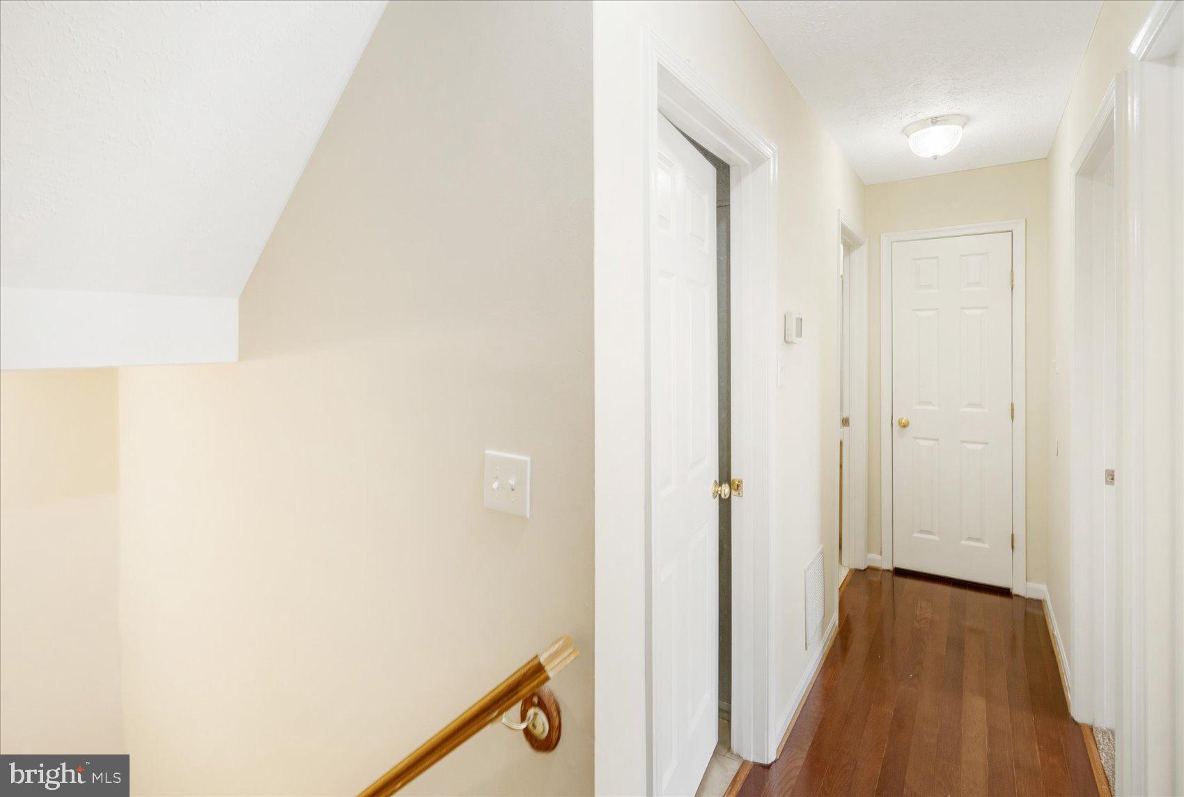4260 Maple Path Circle, Unit 15 Nottingham, MD 21236 - Photo 17 of 35 a view of a hallway with wooden floor