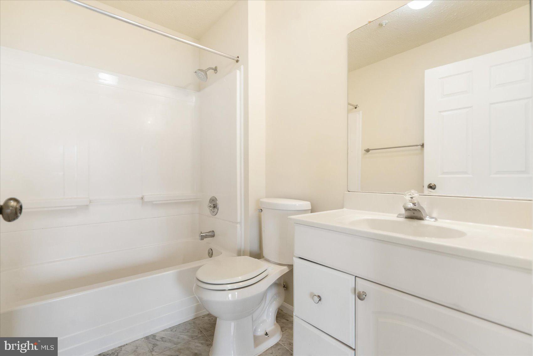 4260 Maple Path Circle, Unit 15 Nottingham, MD 21236 - Photo 31 of 35 a bathroom with a sink a toilet and shower