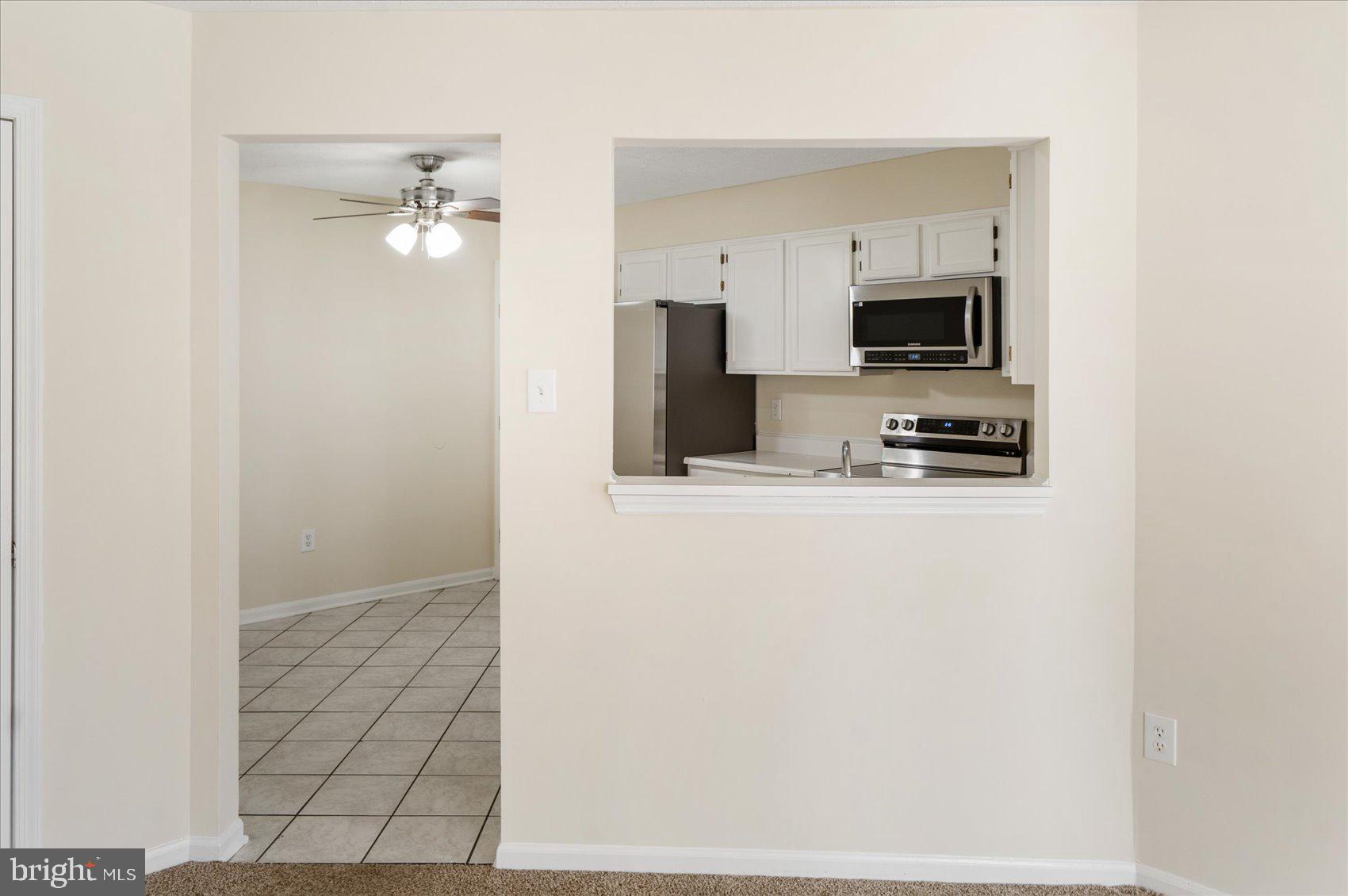 4260 Maple Path Circle, Unit 15 Nottingham, MD 21236 - Photo 8 of 35 a view of a kitchen from the hallway