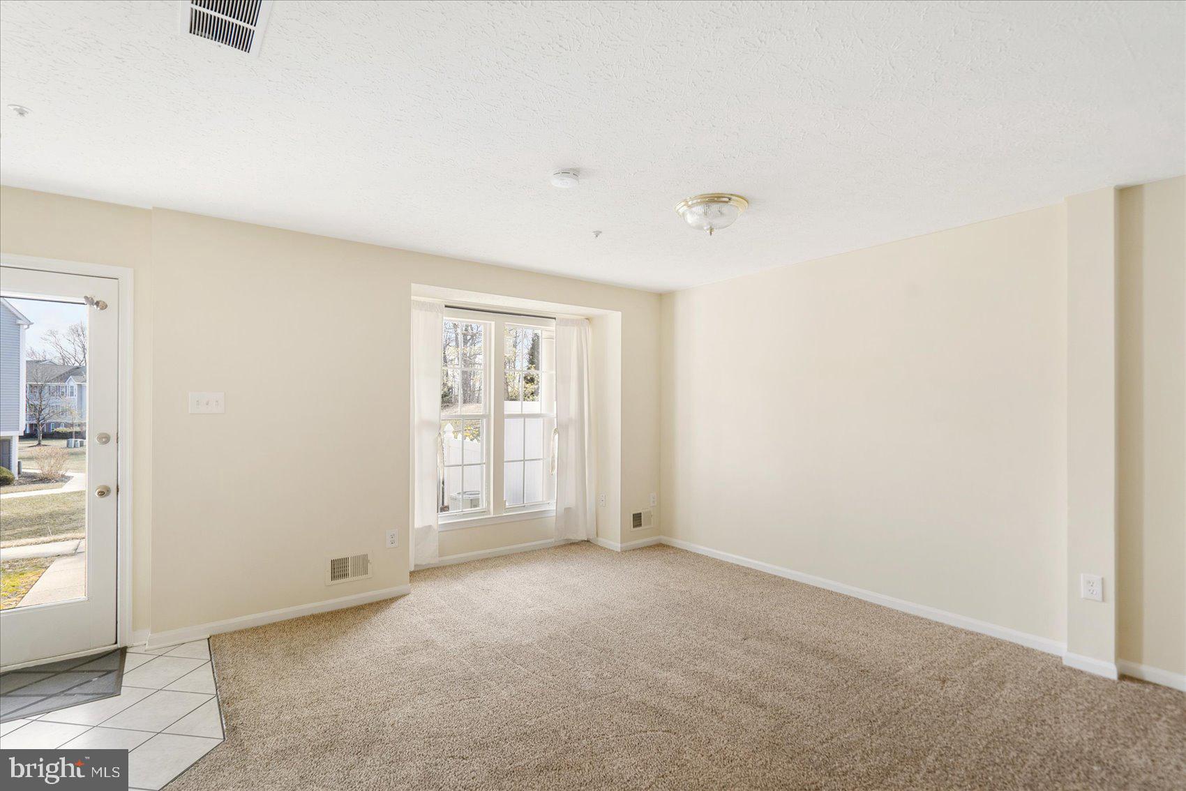4260 Maple Path Circle, Unit 15 Nottingham, MD 21236 - Photo 10 of 35 an empty room with windows