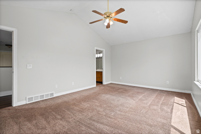 1346 Archmore Drive Springville, UT 84663 - Photo 15 of 32 Spacious room featuring vaulted ceilings, a ceiling fan with integrated lighting, brown carpeting, and a window for natural light