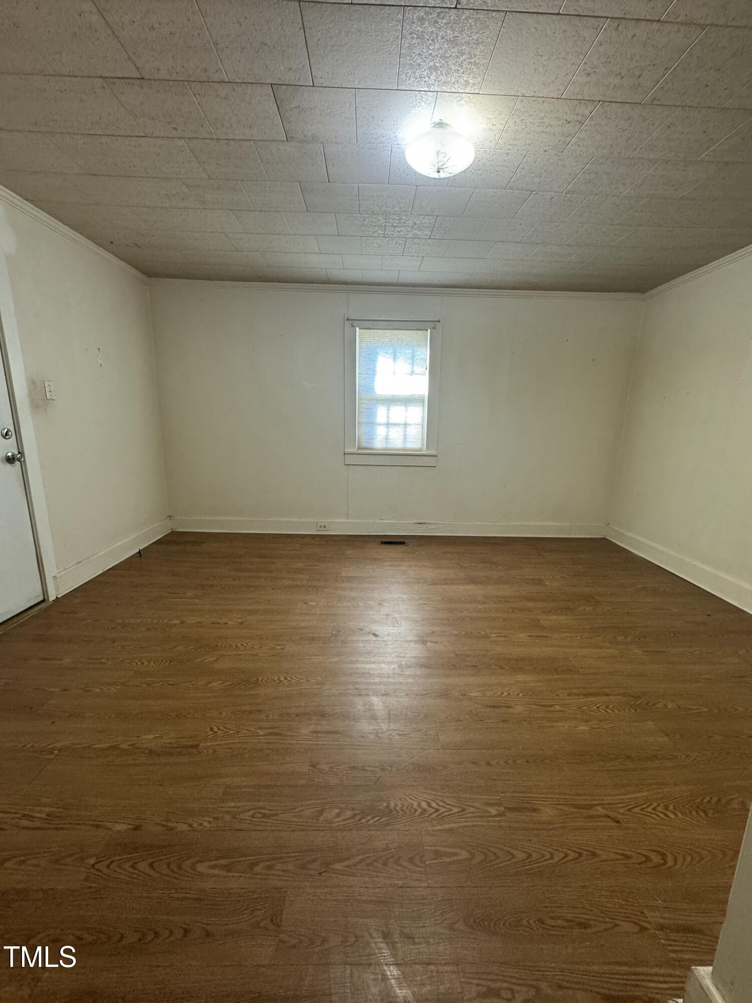 3001 Friendship Road Apex, NC 27502 - Photo 4 of 7 an empty room with a empty space and windows