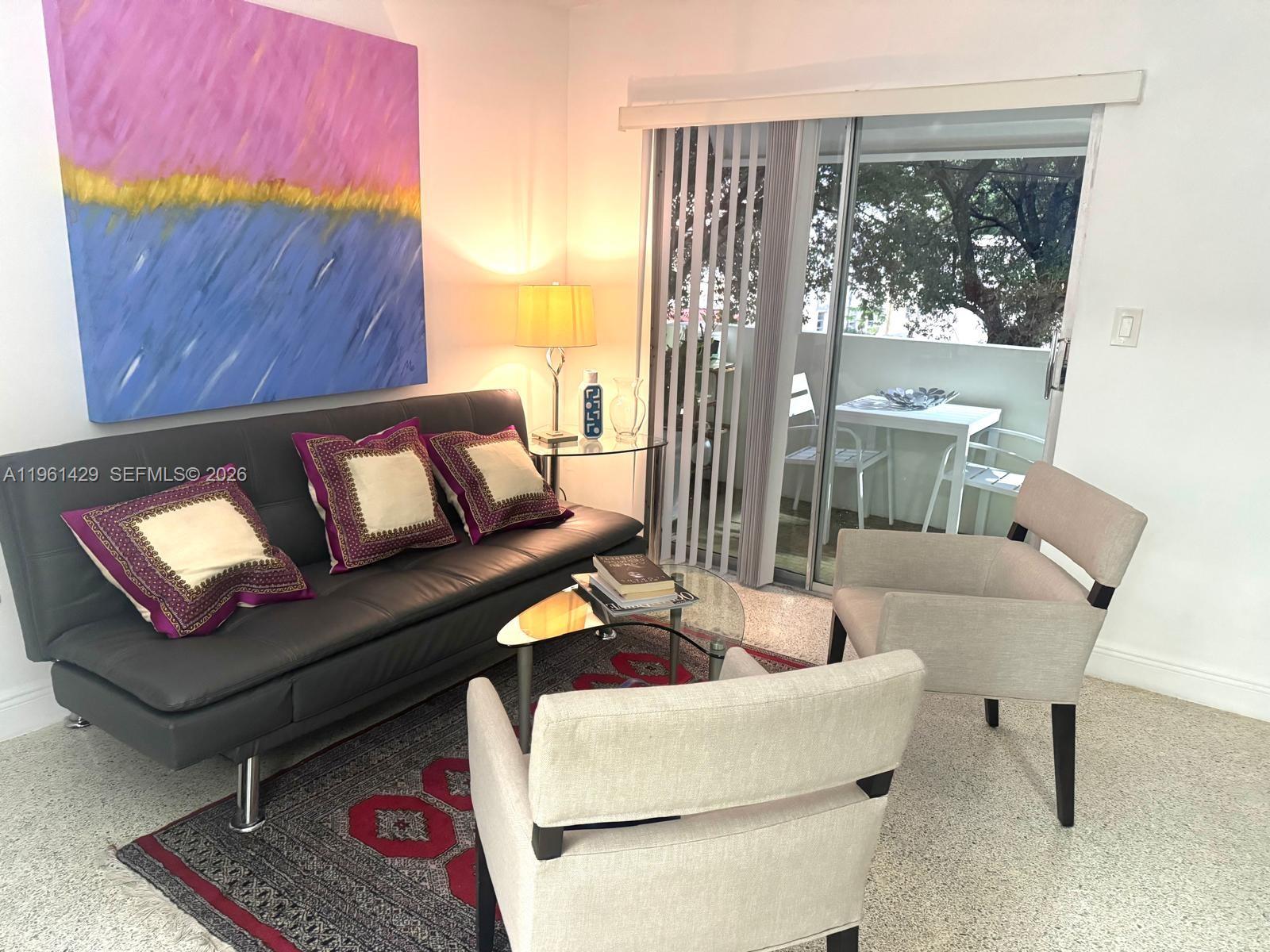 755 Southwest 6th Street, Unit 6 Miami, FL 33130 - Photo 11 of 20 a living room with furniture and a window