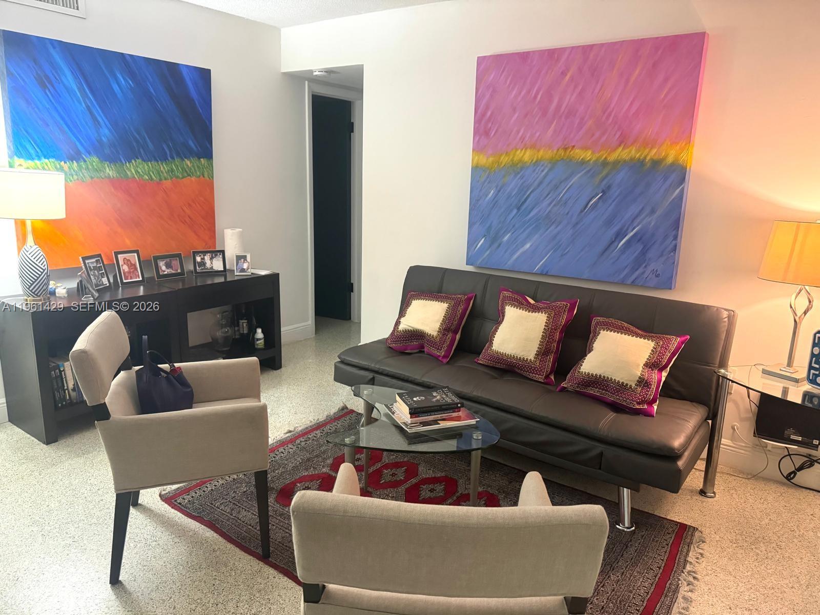 755 Southwest 6th Street, Unit 6 Miami, FL 33130 - Photo 12 of 20 a living room with furniture a rug and a fireplace