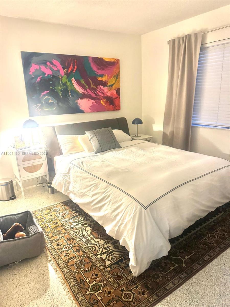 755 Southwest 6th Street, Unit 6 Miami, FL 33130 - Photo 20 of 20 a bedroom with a bed and a painting on the wall