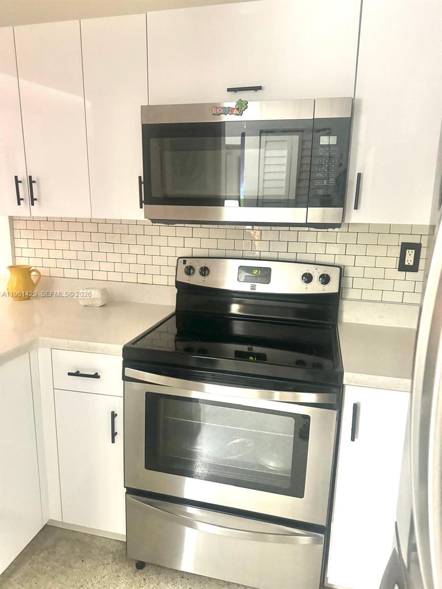755 Southwest 6th Street, Unit 6 Miami, FL 33130 - Photo 8 of 20 a stove top oven sitting inside of a kitchen