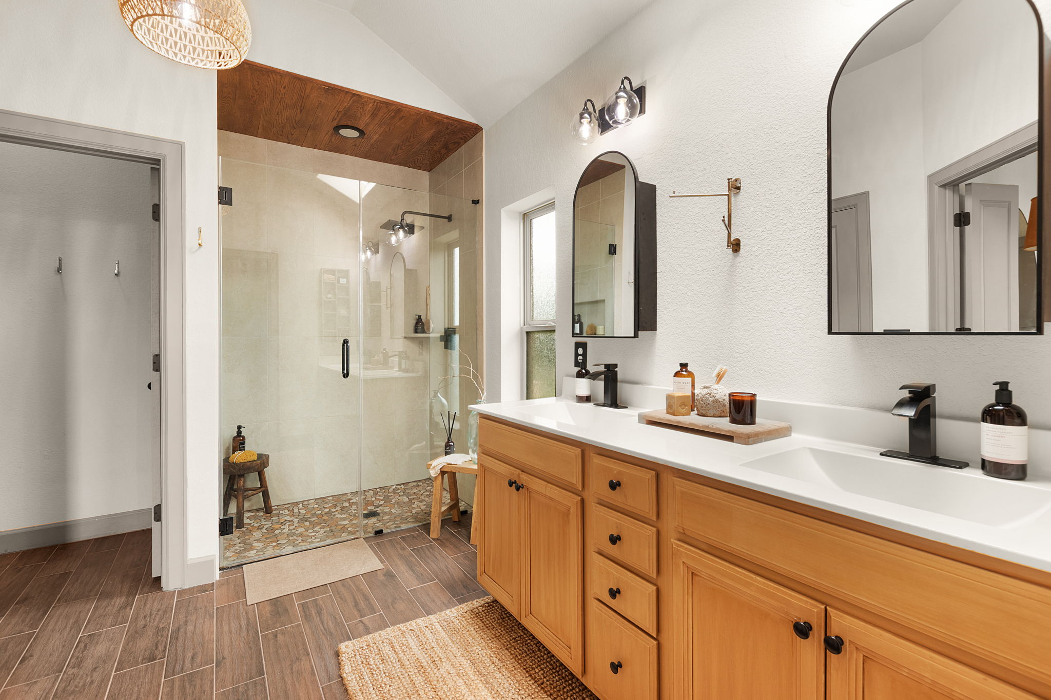 155 Balcones Ridge Way Bertram, TX 78605 - Photo 28 of 37 Recently updated primary bath with dual vanities and medicine cabinet mirrors.